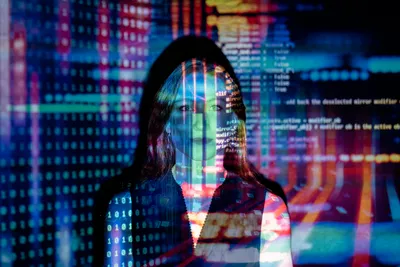 A woman interacting with futuristic technology, symbolizing the human-AI connection.